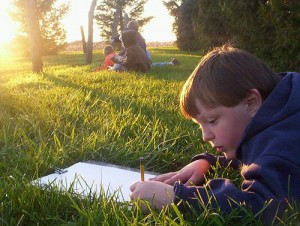 Boy reading outside