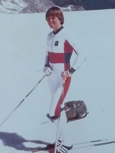 image of cross-country skiier in 1970s style uniform, snow in background